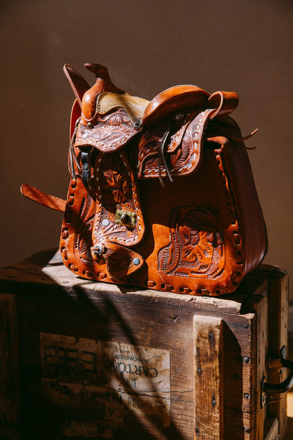 vintage tooled leather saddle bag